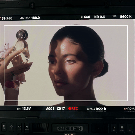 Kylie with Cosmic fragrance, behind the scenes